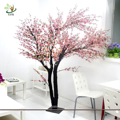 China UVG Indoor artificial peach blossom tree with pink flowers for restaurant decoration supplier