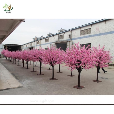 China UVG artificial pink flowering cherry tree in wooden trunk for exhibition hall decoration CHR035 supplier